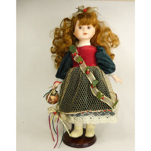 Porcelain doll on stand holding Christmas Ornament 17 inches tall FCJDX